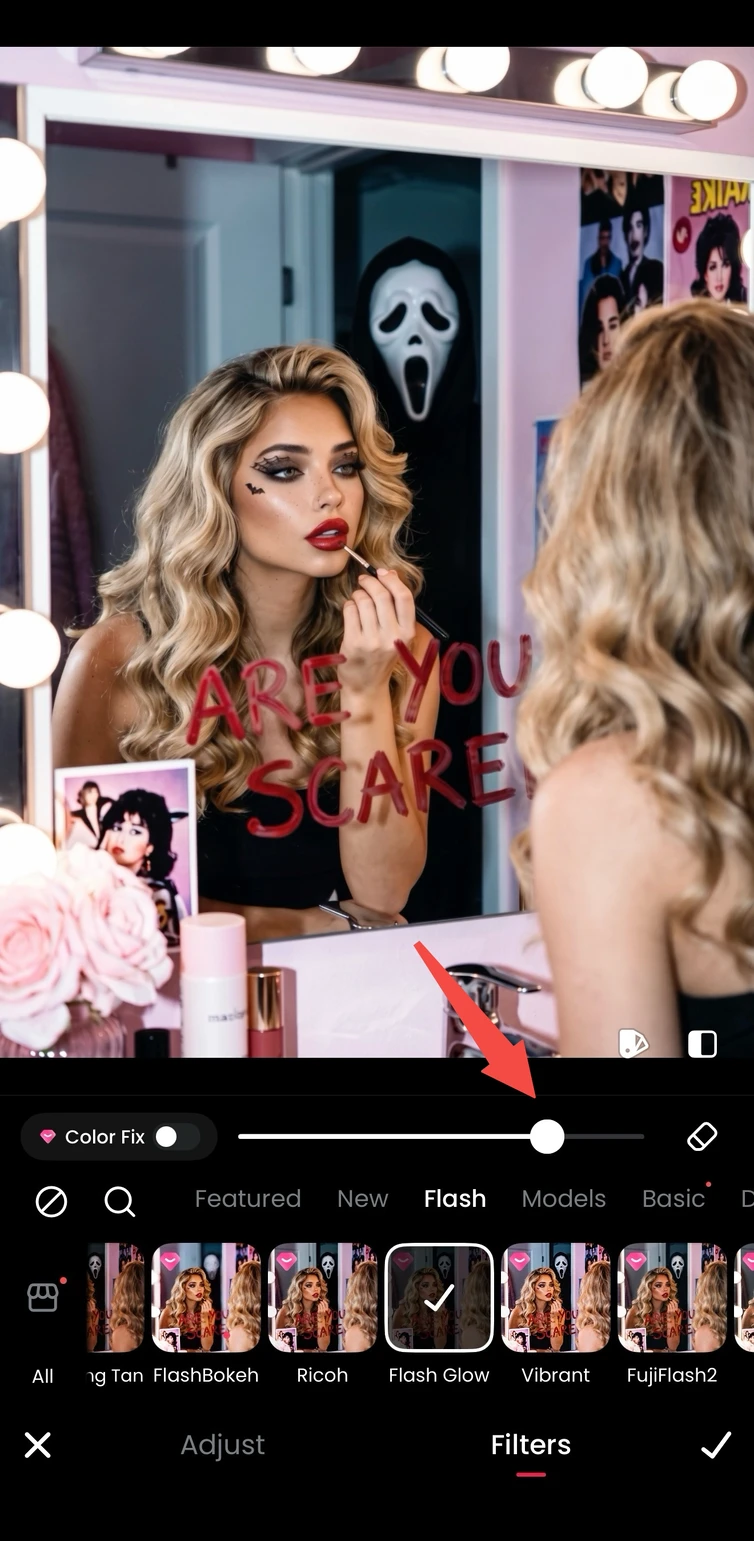 Flash selected in Meitu with the intensity slider visible beneath a Halloween portrait.