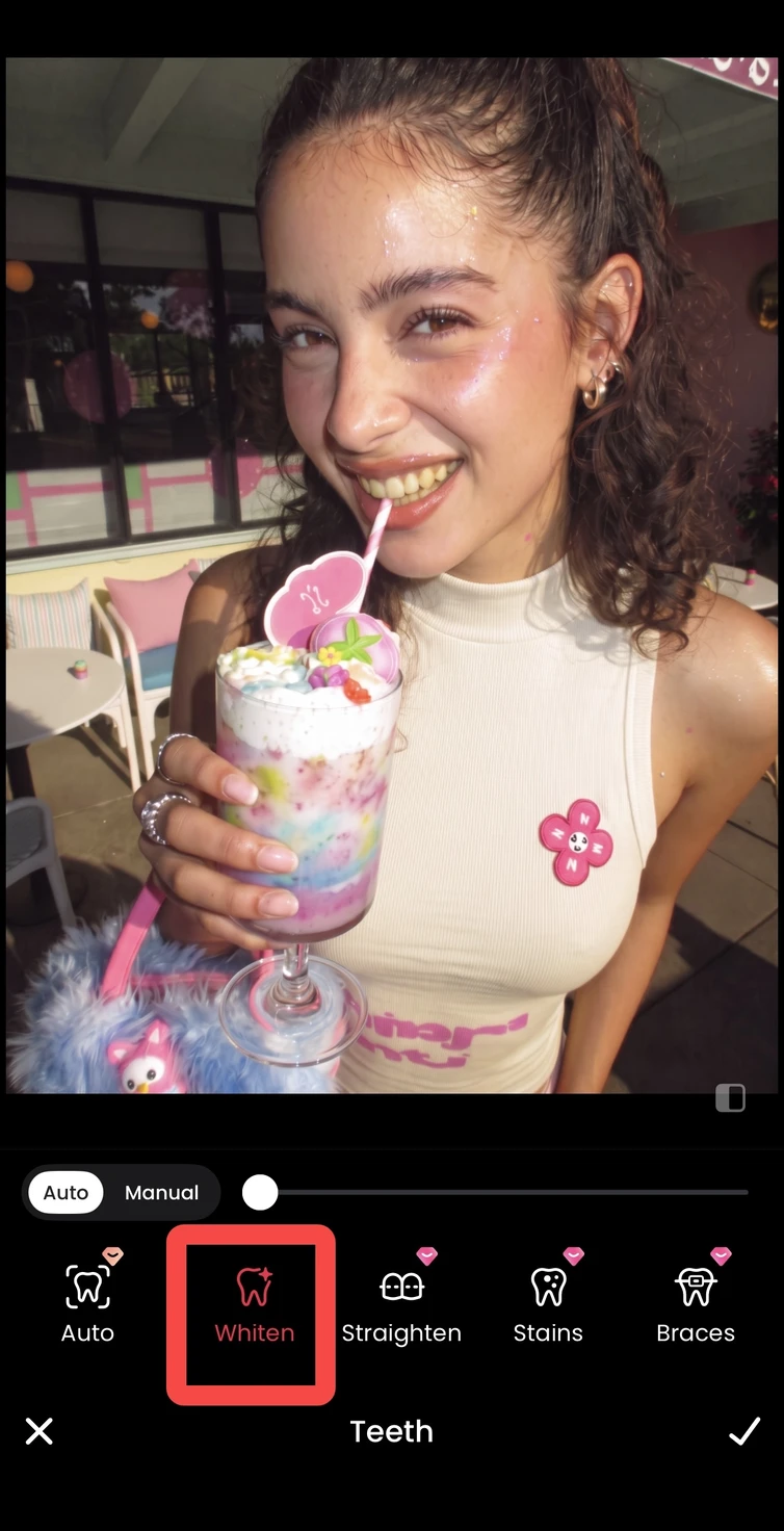 A teeth straightening option previewed on the same smiling portrait in Meitu.