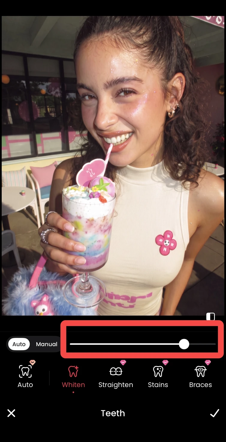 A teeth straightening option previewed on the same smiling portrait in Meitu.